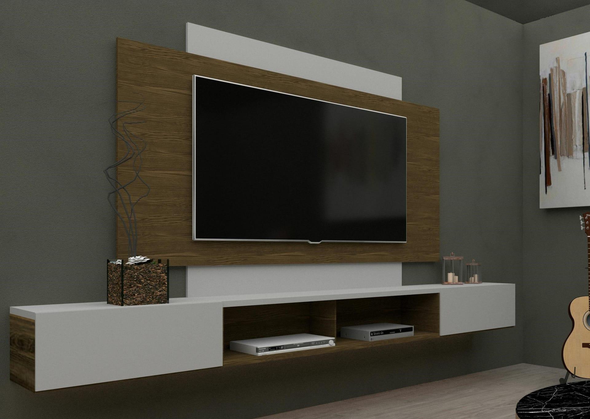 An der Wand montiertes TV-Paneel mit verdecktem Kabelmanagement zwischen Fernseher und Sideboard.